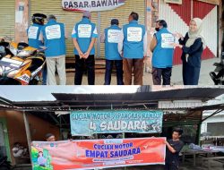 BPJS Kesehatan Muara Bungo Bagikan Spanduk REHAB ke UMKM dan Rompi kepada Tukang Ojek